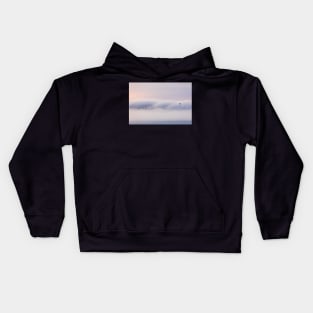 Dreamy thick fog at sunrise over hill Kids Hoodie